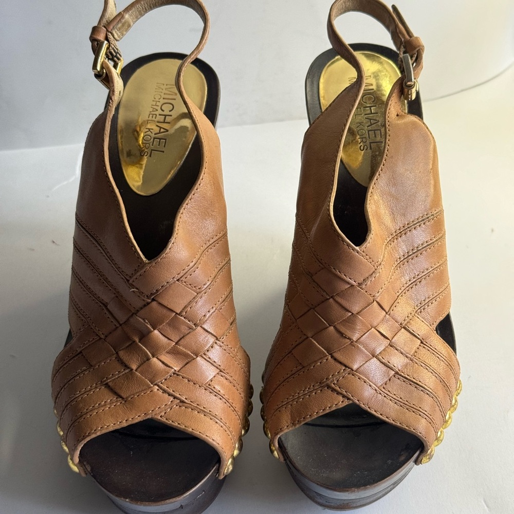 Michael Kors brown wedges in size 6 gold metal buckles